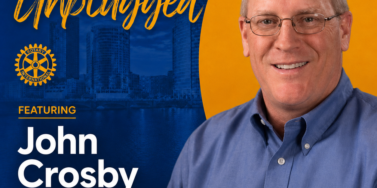 Poster for Grand Rapids Rotary Unplugged featuring John Crosby, VP of Operations, with city skyline in blue and yellow design.