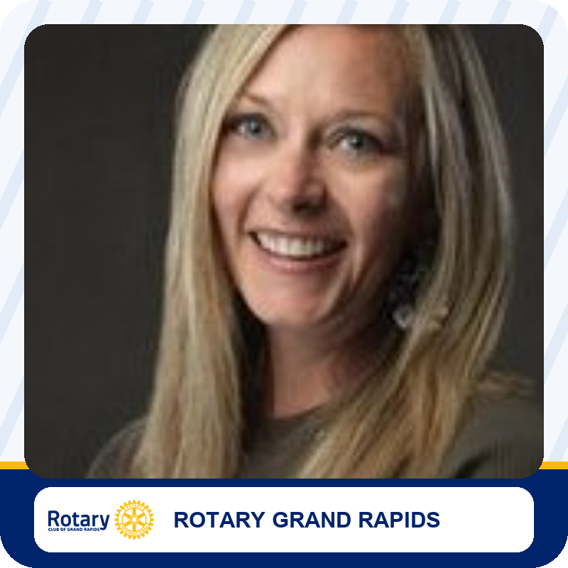 Portrait of a smiling woman with long blonde hair, associated with Rotary Grand Rapids